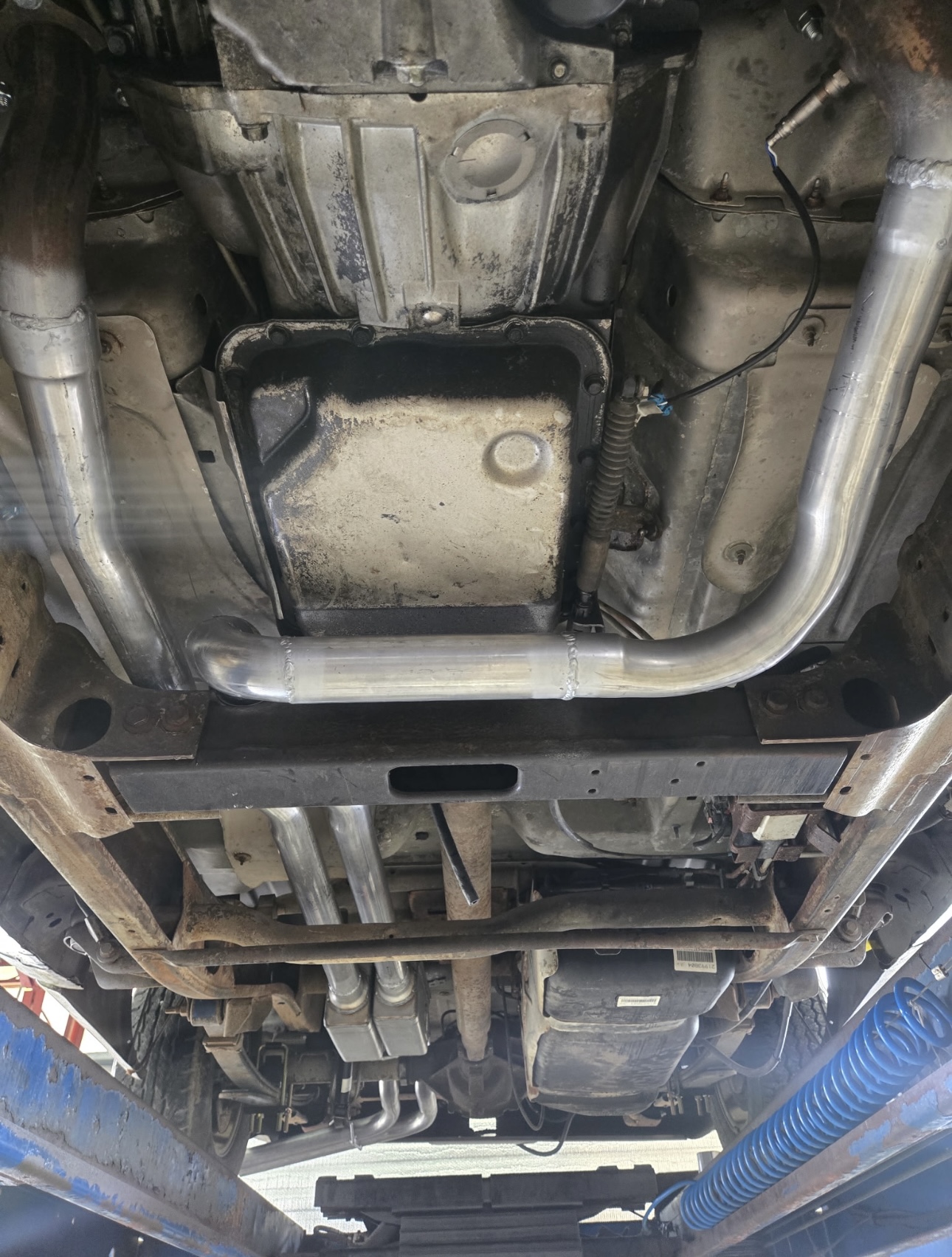 Truck underbody showing transmission and exhaust components